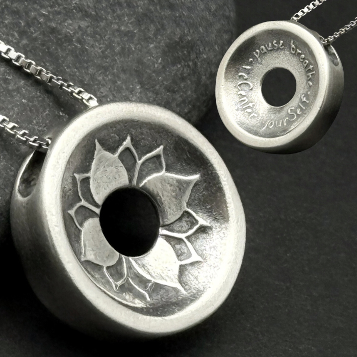 Front and back of the Heart Harmony 24mm pendant on a sterling silver chain